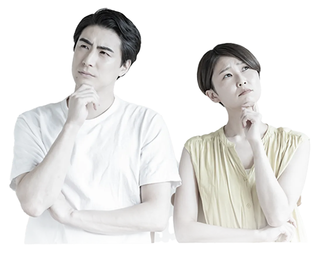 不安そうに悩む男女の写真